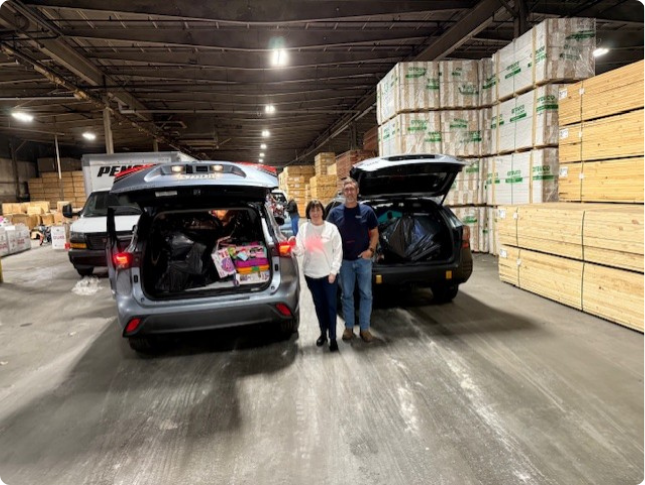 becky and ed mccray with toys for tots donations